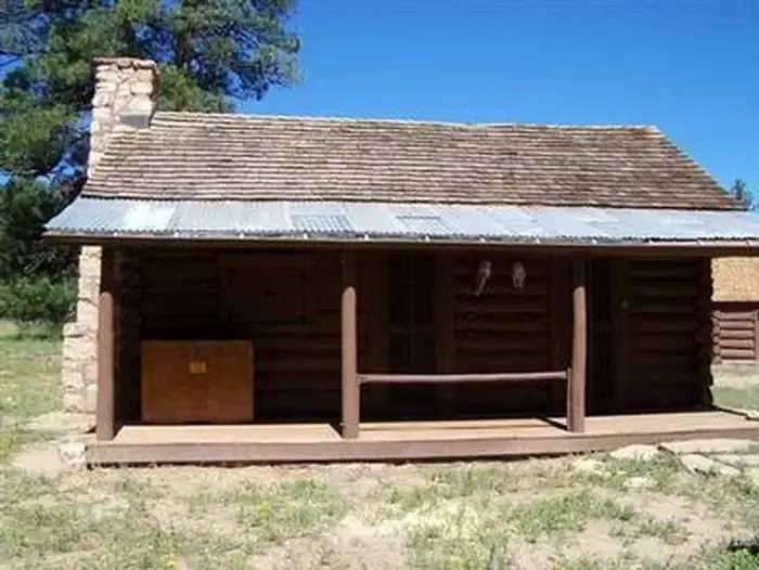 An close-up view of historic Hull Cabin from the exterior showing off the large covered porch.