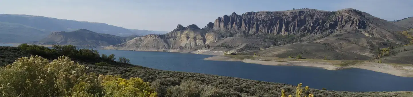 A landscape shot of Blue Mesa Reservoir with peaks in the background