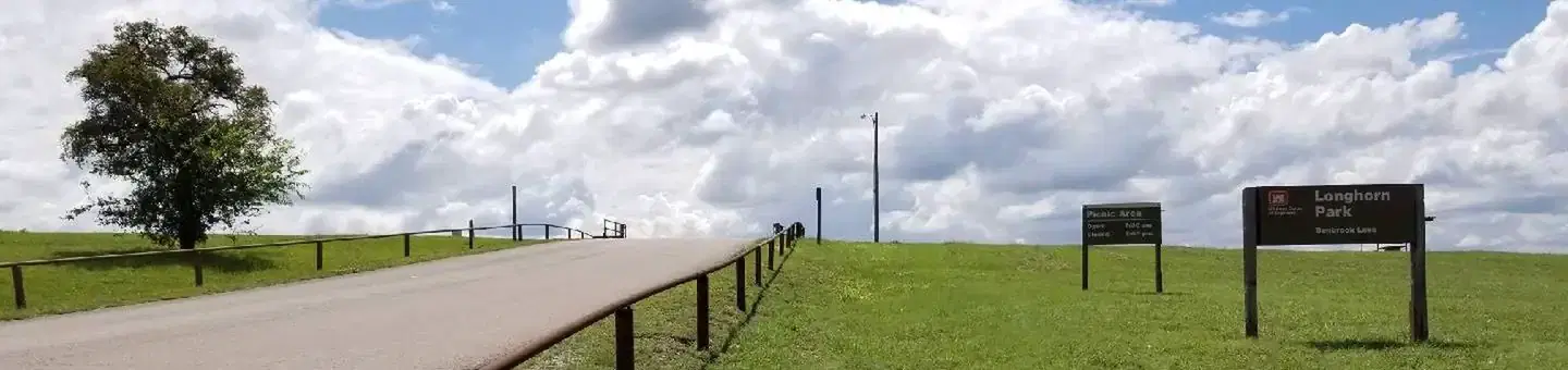 Longhorn Park entrance driveway and park sign
