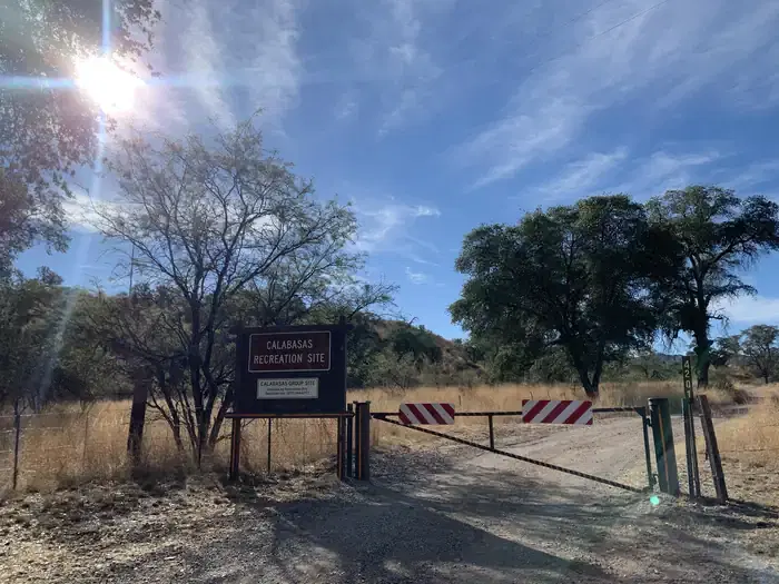 A locked entry gate to the campground with a sign that says "Calabasas Recreation Site"ite