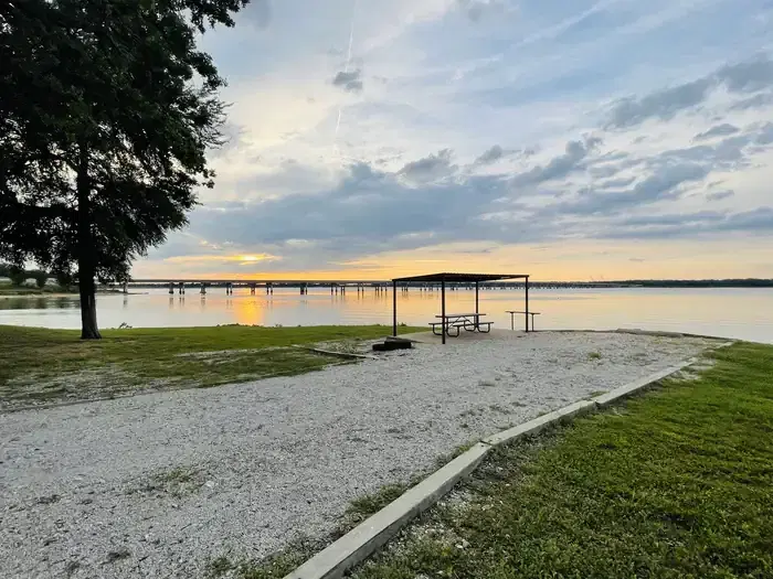 A photo of facility JUNIPER POINT with Picnic Table, Electricity Hookup, Fire Pit, Waterfront, Water Hookup